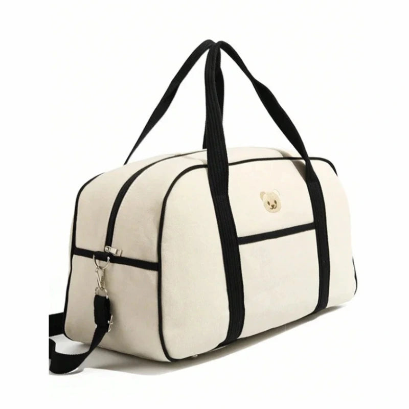 Sac à langer beige avec détail noir