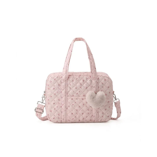 Sac à langer fleuri rose sur fond blanc, vue de face