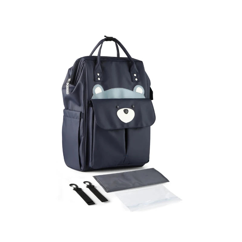 Sac à langer imperméable accroché à une poussette grâce aux sangles incluses